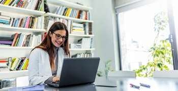 Doctor looking at laptop